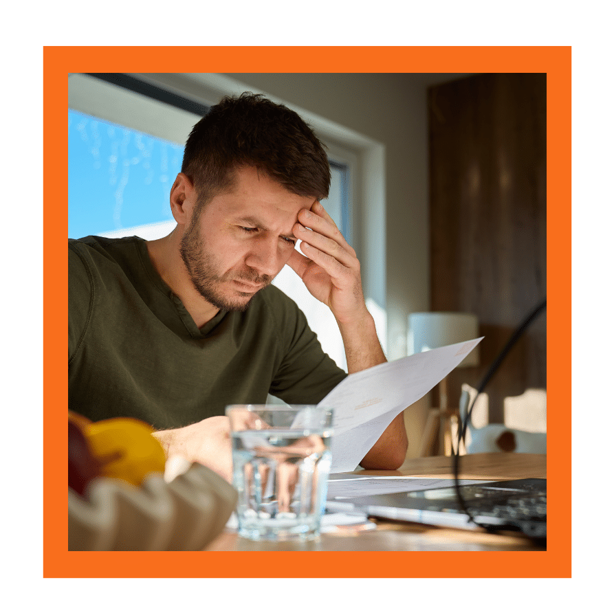 Worried man reviewing an important legal notice at home