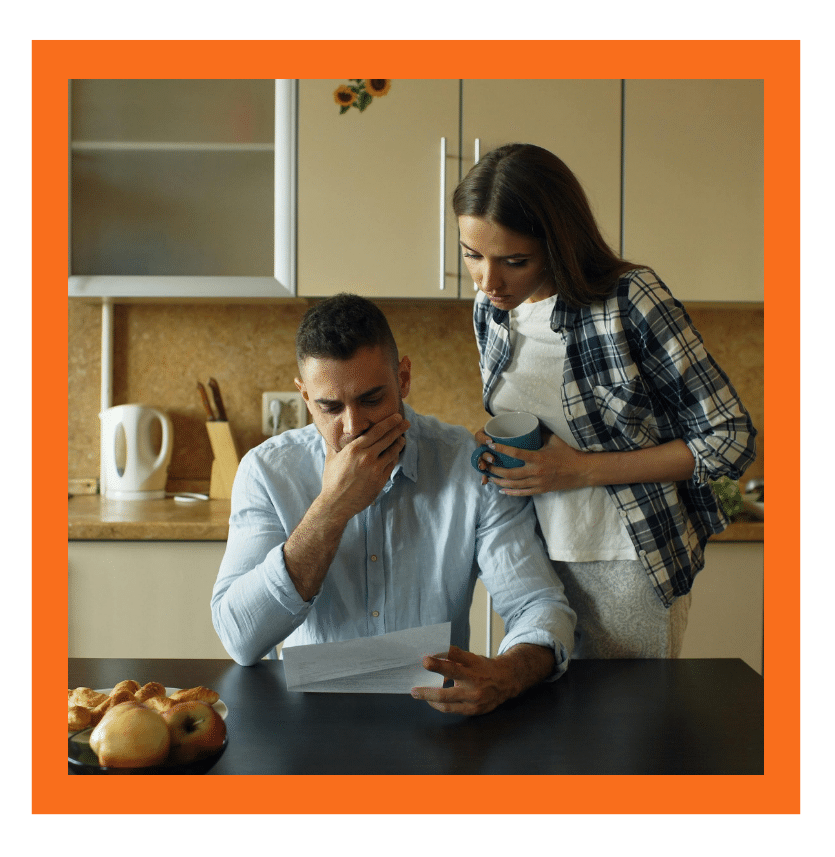 Concerned couple reviewing an immigration letter together at home